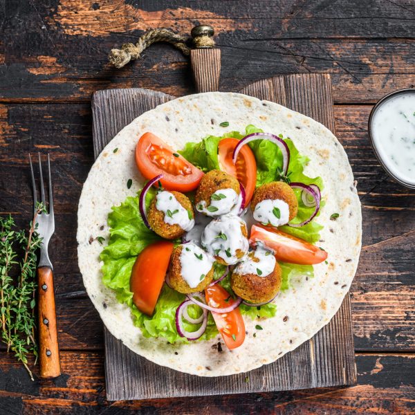 falafel-wrap-with-vegetables-on-wooden-table-2026-03-17-05-44-01-utc (1)