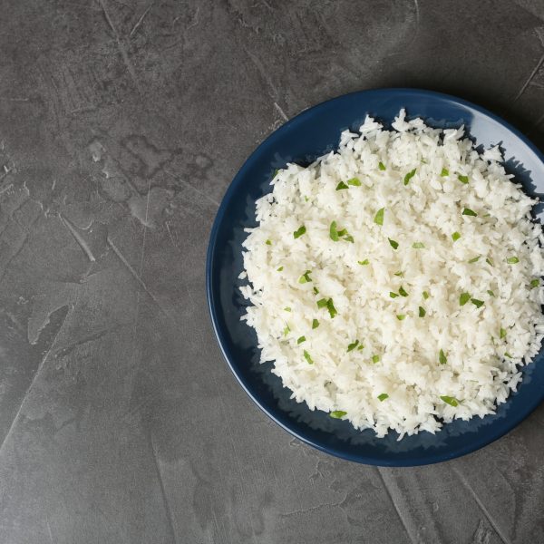 plate-of-boiled-rice-on-grey-background-top-view-2026-03-08-23-04-11-utc (1)